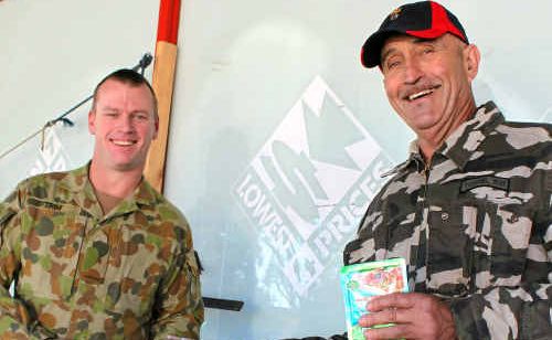 Private Wayne Trim and Johnno Felton with some of the goodies in a soldier’s daily rations pack. Private Wayne Trim and Johnno Felton with some of the goodies in a soldier’s daily rations pack.